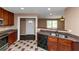 A kitchen featuring wood cabinets, granite countertops and an open floorplan at 2702 Rollingwood Se Ln, Atlanta, GA 30316