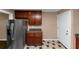 This is a kitchen with stainless steel refrigerator and wood cabinets at 2702 Rollingwood Se Ln, Atlanta, GA 30316