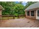 Spacious wooden deck overlooking a lush green backyard surrounded by mature trees at 362 Clyde Ct, Mcdonough, GA 30252