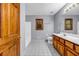 Bathroom with vanity, tile floors, neutral paint and a window, creating a clean and functional space at 362 Clyde Ct, Mcdonough, GA 30252