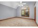 Bright bedroom with carpet, large window, and neutral paint, offering a serene space at 362 Clyde Ct, Mcdonough, GA 30252