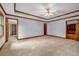Spacious bedroom with neutral carpet, a trey ceiling with wood trim, and natural light from windows at 362 Clyde Ct, Mcdonough, GA 30252