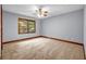 Cozy bedroom with carpet, window, and neutral paint, creating a comfortable space at 362 Clyde Ct, Mcdonough, GA 30252