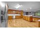 Bright kitchen has stainless steel appliances, a central island, and wood cabinets at 362 Clyde Ct, Mcdonough, GA 30252