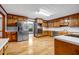 Large kitchen with stainless steel appliances, wooden cabinets, white counters, and hardwood flooring at 362 Clyde Ct, Mcdonough, GA 30252