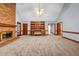 Spacious living room features a brick fireplace and built-in shelving at 362 Clyde Ct, Mcdonough, GA 30252