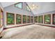 Bright sunroom with vaulted ceilings and large windows offering great views at 362 Clyde Ct, Mcdonough, GA 30252