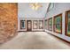 Spacious sunroom with brick wall and large windows for natural light at 362 Clyde Ct, Mcdonough, GA 30252