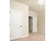 Bedroom features a charming light fixture and a doorway to another room at 40 Oakwood Dr, Covington, GA 30016
