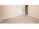 Bedroom with neutral carpet, featuring baseboard trim and electrical outlets at 40 Oakwood Dr, Covington, GA 30016