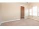 Bedroom featuring a walk-in closet and a window with bright natural light at 40 Oakwood Dr, Covington, GA 30016