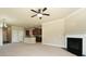 Open-concept living area with a fireplace and seamless transition to the modern kitchen at 40 Oakwood Dr, Covington, GA 30016