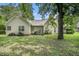 Spacious backyard with green grass and a covered patio, great for outdoor entertaining at 1907 S Van Wert Rd, Villa Rica, GA 30180