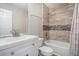 Full bathroom features updated vanity and tile in shower and tub at 1907 S Van Wert Rd, Villa Rica, GA 30180
