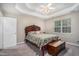 Bedroom featuring a large window, carpet floors and ornate bed frame at 1907 S Van Wert Rd, Villa Rica, GA 30180