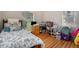 Bedroom with light-filled window and hard wood flooring at 1907 S Van Wert Rd, Villa Rica, GA 30180