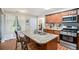 Well-equipped kitchen featuring granite countertops, stainless steel appliances, and a breakfast bar at 1907 S Van Wert Rd, Villa Rica, GA 30180