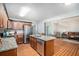 Open kitchen featuring granite countertops, stainless steel appliances, an island, and hardwood floors at 1907 S Van Wert Rd, Villa Rica, GA 30180