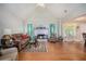Inviting living room with a vaulted ceiling, fireplace, hardwood floors, and lots of natural light at 1907 S Van Wert Rd, Villa Rica, GA 30180