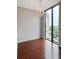 Sunlit bedroom features sleek hardwood floors and a large window, offering plenty of natural light and cityscape views at 3040 Peachtree Nw Rd # 1501, Atlanta, GA 30305