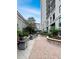 Outdoor grilling area with stone planters, multiple grills, and a paver walkway at 3040 Peachtree Nw Rd # 1501, Atlanta, GA 30305