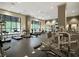 Large gym with many machines, mirrors, and windows that allow lots of natural light to brighten the space at 3040 Peachtree Nw Rd # 1501, Atlanta, GA 30305