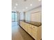 Open kitchen boasts a large island with sink and countertop space, perfect for entertaining and meal preparation at 3040 Peachtree Nw Rd # 1501, Atlanta, GA 30305