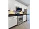 Stainless steel appliances complement the sleek design of this modern kitchen at 3040 Peachtree Nw Rd # 1501, Atlanta, GA 30305