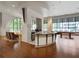 A stylish lounge with bar, kitchen, hardwood floors, comfortable seating and pool table at 3040 Peachtree Nw Rd # 1501, Atlanta, GA 30305