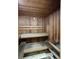 Interior view of a wood-paneled sauna featuring built-in benches and a thermometer at 3040 Peachtree Nw Rd # 1501, Atlanta, GA 30305