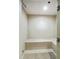 View of a steam room with tiled walls, a built-in bench, and a non-slip floor mat at 3040 Peachtree Nw Rd # 1501, Atlanta, GA 30305