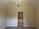Neutral primary bedroom with vaulted ceiling and an ensuite bathroom at 512 Ollas Walk, Mcdonough, GA 30252