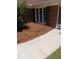 Charming home exterior with a garden in front of the window and sidewalk at 512 Ollas Walk, Mcdonough, GA 30252