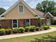 Attractive single Gathering home featuring a brick facade and manicured landscaping at 512 Ollas Walk, Mcdonough, GA 30252