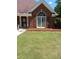 Exterior showing a manicured lawn and decorative flowers at 512 Ollas Walk, Mcdonough, GA 30252