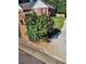 Charming home featuring a lush rose bush and well-manicured lawn at 512 Ollas Walk, Mcdonough, GA 30252