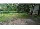 View of backyard with fenced in area and mature trees offering tons of privacy at 5710 Cardigan Trce, Sugar Hill, GA 30518