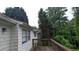 Rustic, wood deck overlooking an expansive and lush backyard with mature trees at 5710 Cardigan Trce, Sugar Hill, GA 30518