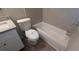 Bright bathroom with a tiled shower-tub, toilet, and updated vanity at 5710 Cardigan Trce, Sugar Hill, GA 30518