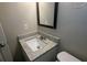 Modern bathroom with granite sink and updated fixtures at 5710 Cardigan Trce, Sugar Hill, GA 30518