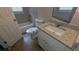 Updated bathroom with granite countertop, white vanity, and shower-tub combo at 5710 Cardigan Trce, Sugar Hill, GA 30518