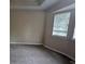Bedroom with neutral colored carpet and paint and plenty of natural light at 5710 Cardigan Trce, Sugar Hill, GA 30518
