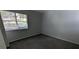 Bedroom with neutral walls, carpeted floor, and window bringing in sunlight at 5710 Cardigan Trce, Sugar Hill, GA 30518