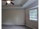 Spacious bedroom features ceiling fan and tray ceiling at 5710 Cardigan Trce, Sugar Hill, GA 30518