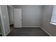 Cozy bedroom featuring a door and window that allows for lots of natural light at 5710 Cardigan Trce, Sugar Hill, GA 30518