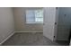 Cozy bedroom featuring plush carpeting and a view to a walk-in closet at 5710 Cardigan Trce, Sugar Hill, GA 30518