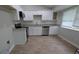 Modern kitchen with stainless steel appliances, new cabinets, and granite countertops at 5710 Cardigan Trce, Sugar Hill, GA 30518