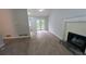 Bright living room with modern floors and a charming fireplace at 5710 Cardigan Trce, Sugar Hill, GA 30518