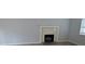Bright living room with a cozy fireplace and plenty of natural light at 5710 Cardigan Trce, Sugar Hill, GA 30518