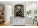 Elegant bar area with marble countertop, white cabinetry, and mirrored backsplash in a neutrally decorated home at 5968 Reddington Way, Sandy Springs, GA 30328